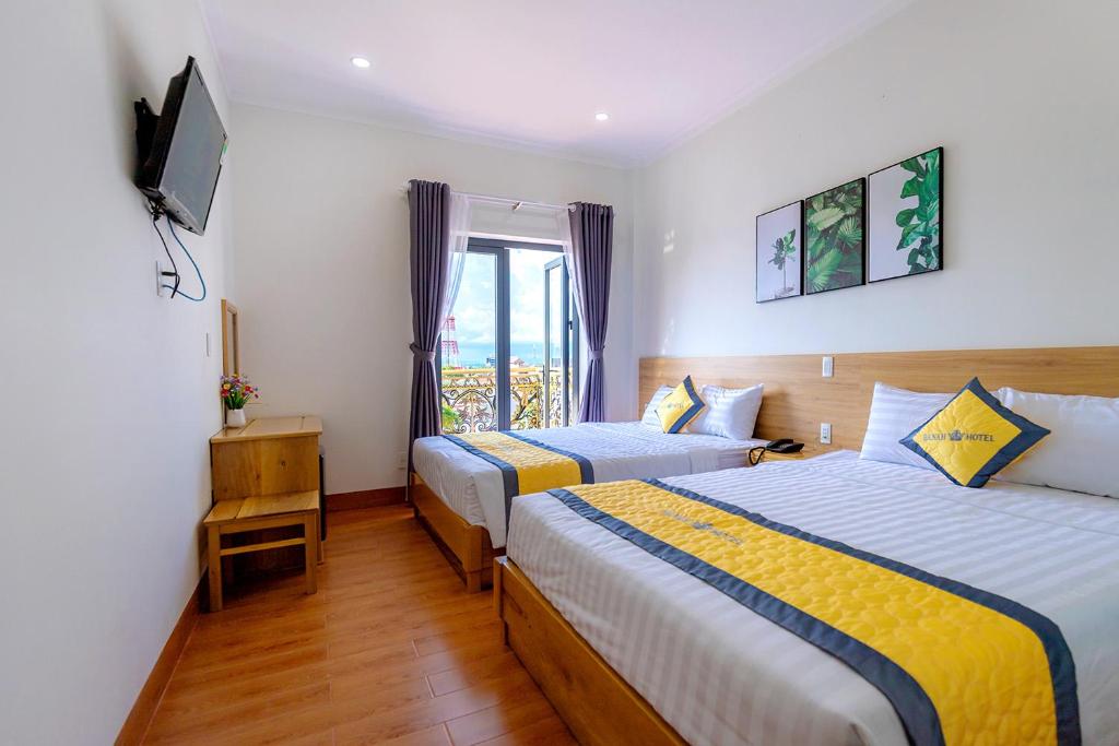 Katil atau katil-katil dalam bilik di Khách sạn Hanah Phan Thiết