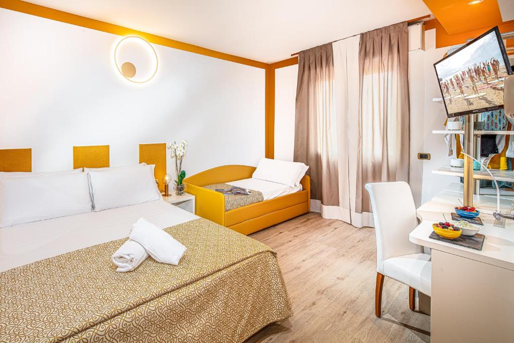 Postel nebo postele na pokoji v ubytování Hotel Karinzia