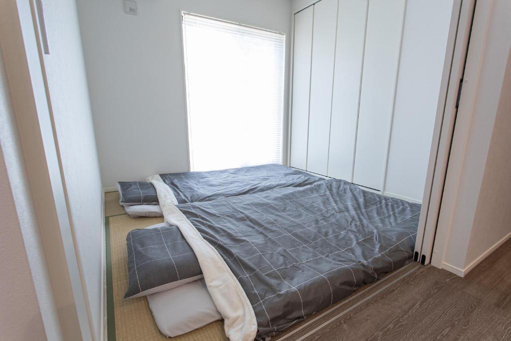 Postel nebo postele na pokoji v ubytování Mova Villa Ozu