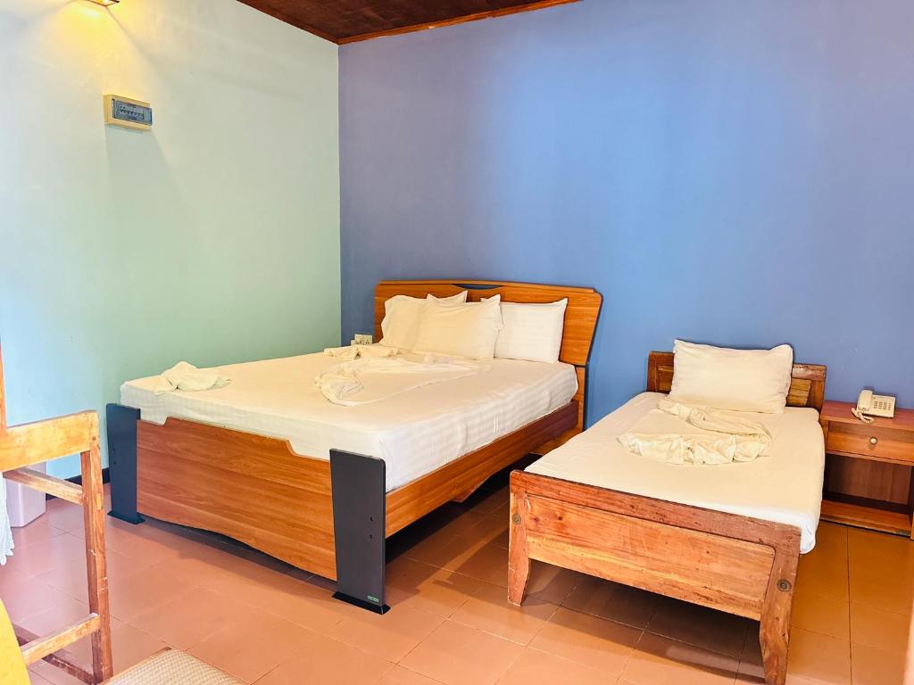 Postel nebo postele na pokoji v ubytování Gamodh Citadel Resort