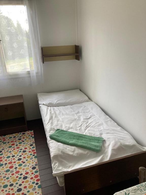 Postel nebo postele na pokoji v ubytování Churáňov Chatičky
