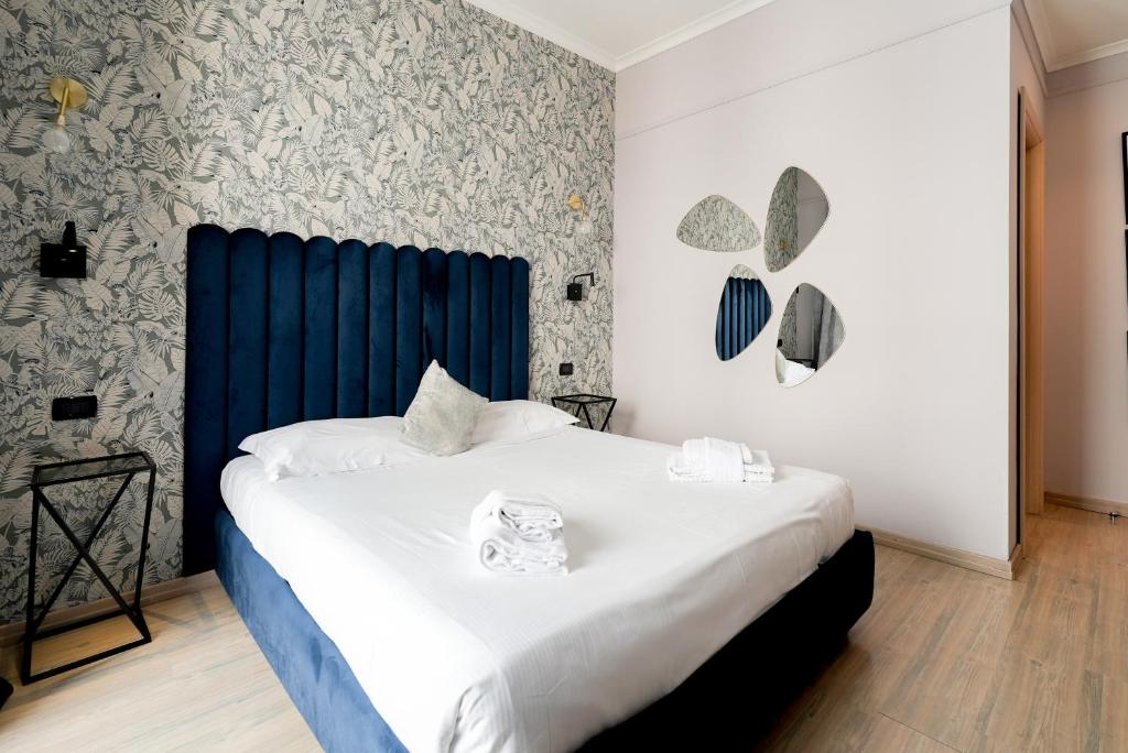 Postel nebo postele na pokoji v ubytování R-home fine rooms guesthouse