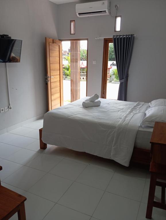 Postel nebo postele na pokoji v ubytování Abhi hotel