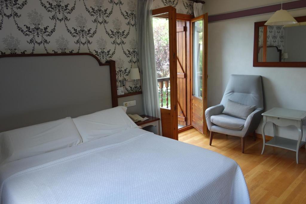 Postel nebo postele na pokoji v ubytování Hotel Abetos