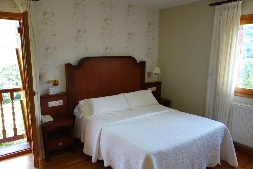 Postel nebo postele na pokoji v ubytování Hotel Abetos