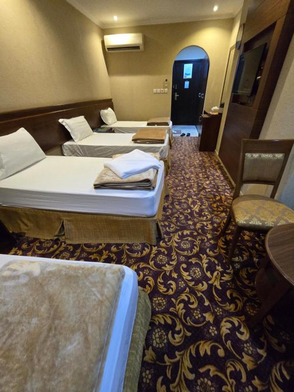 Postel nebo postele na pokoji v ubytování Diouf Al Maqam Hotel 3