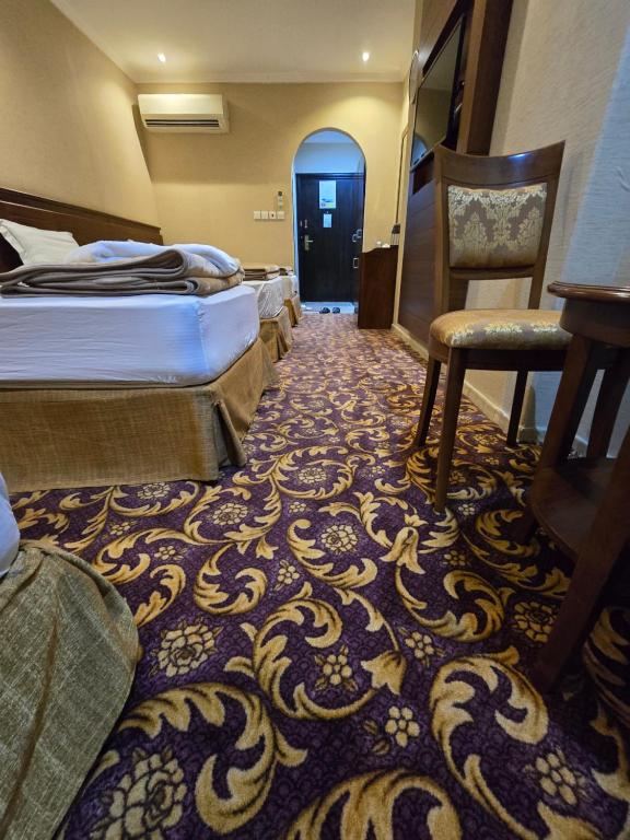 Postel nebo postele na pokoji v ubytování Diouf Al Maqam Hotel 3