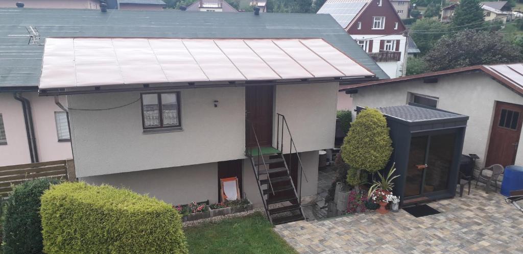 an aerial view of a house with a metal roof at Chata SLUKA in Poniklá