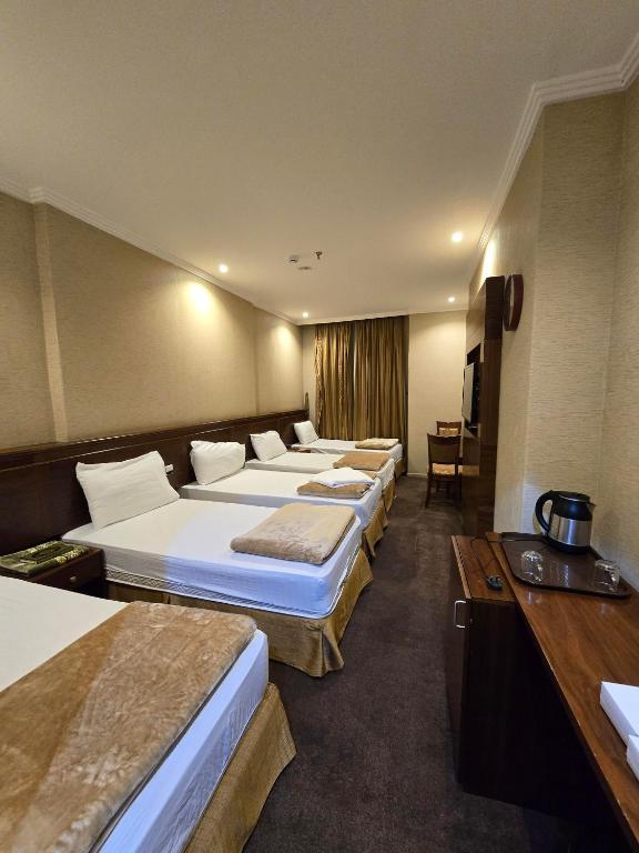 Postel nebo postele na pokoji v ubytování Diouf Al Maqam Hotel 3