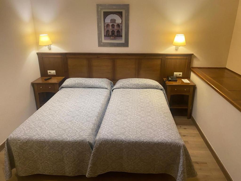 Posteľ alebo postele v izbe v ubytovaní Hostal Carmen