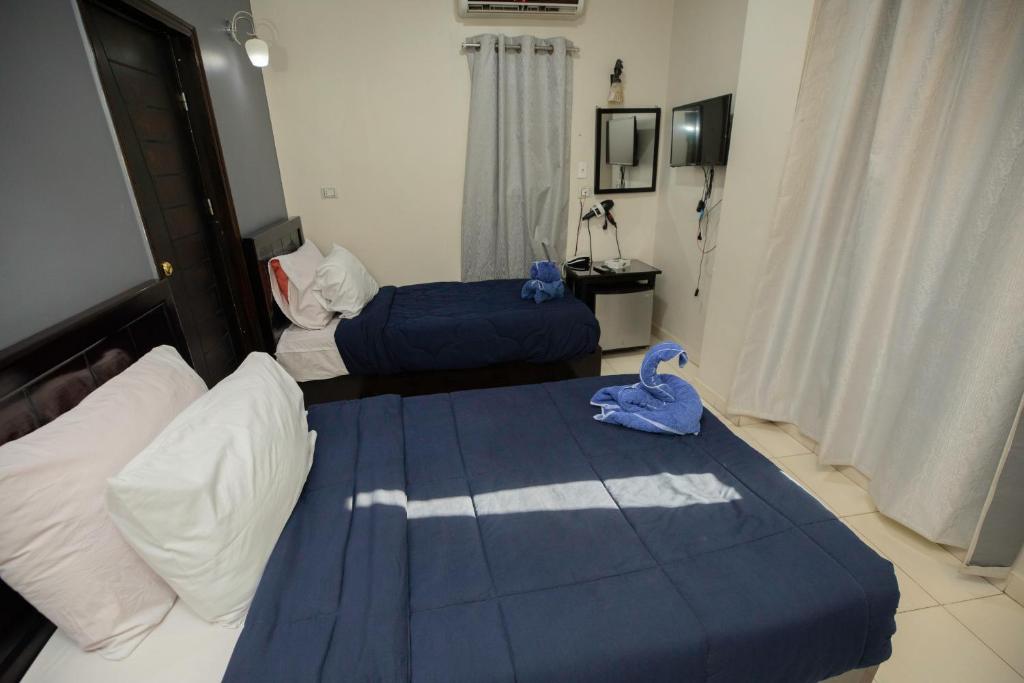 Postel nebo postele na pokoji v ubytování Horus Guest House Pyramids