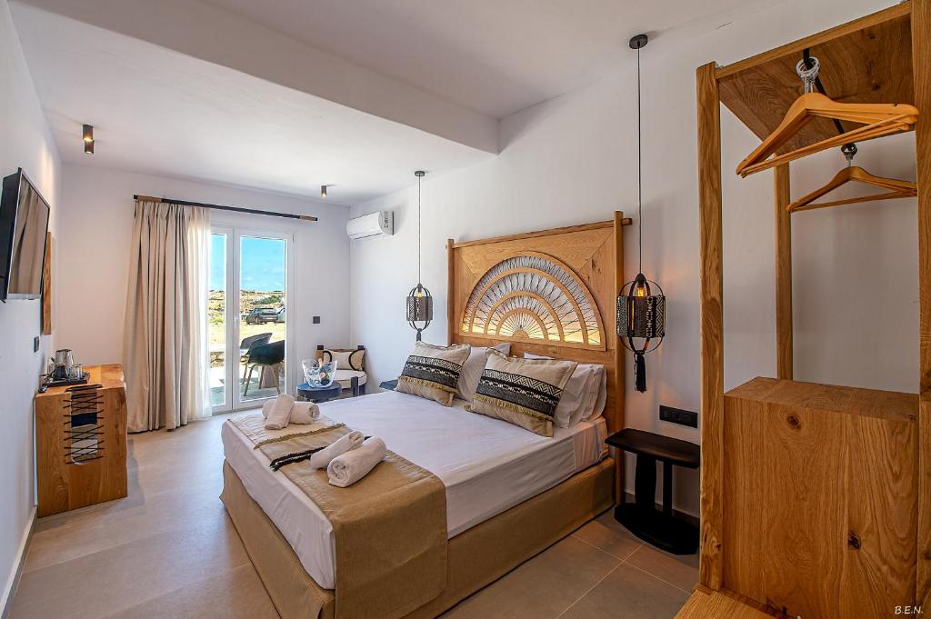 Postel nebo postele na pokoji v ubytování Le Palme Mykonos