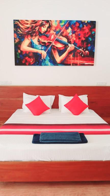 Postel nebo postele na pokoji v ubytování Hemalie Resort Mirissa