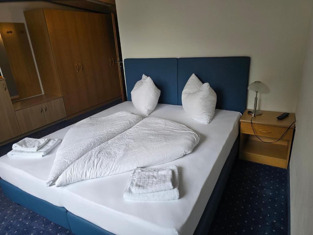Postel nebo postele na pokoji v ubytování Bad Kochenmoos