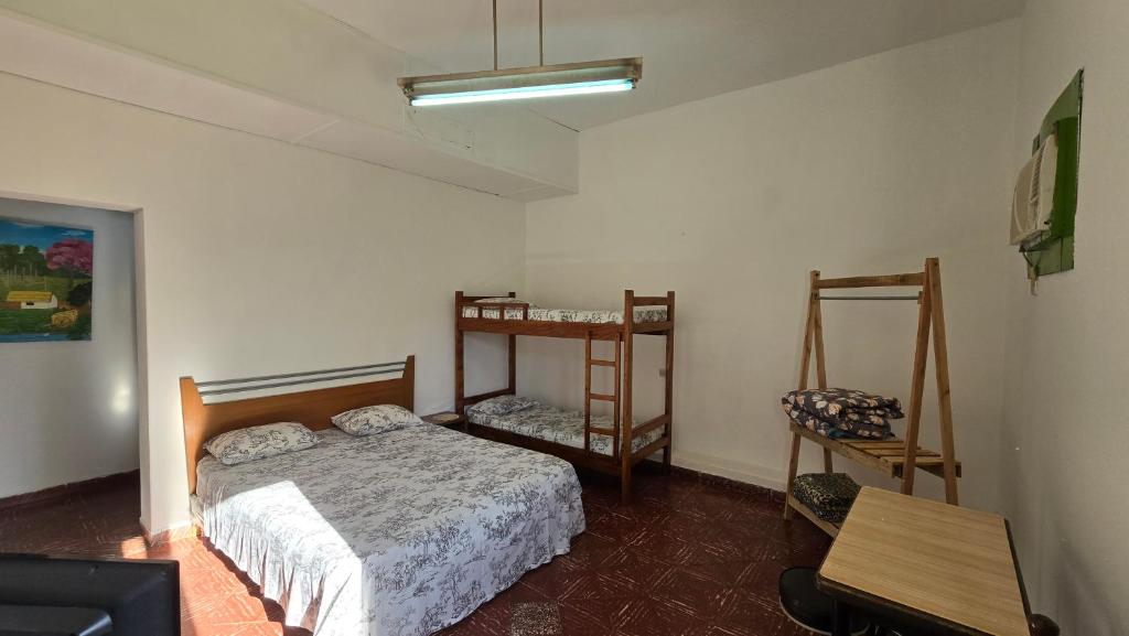 Un pat sau paturi într-o cameră la Tagua Hospedaje