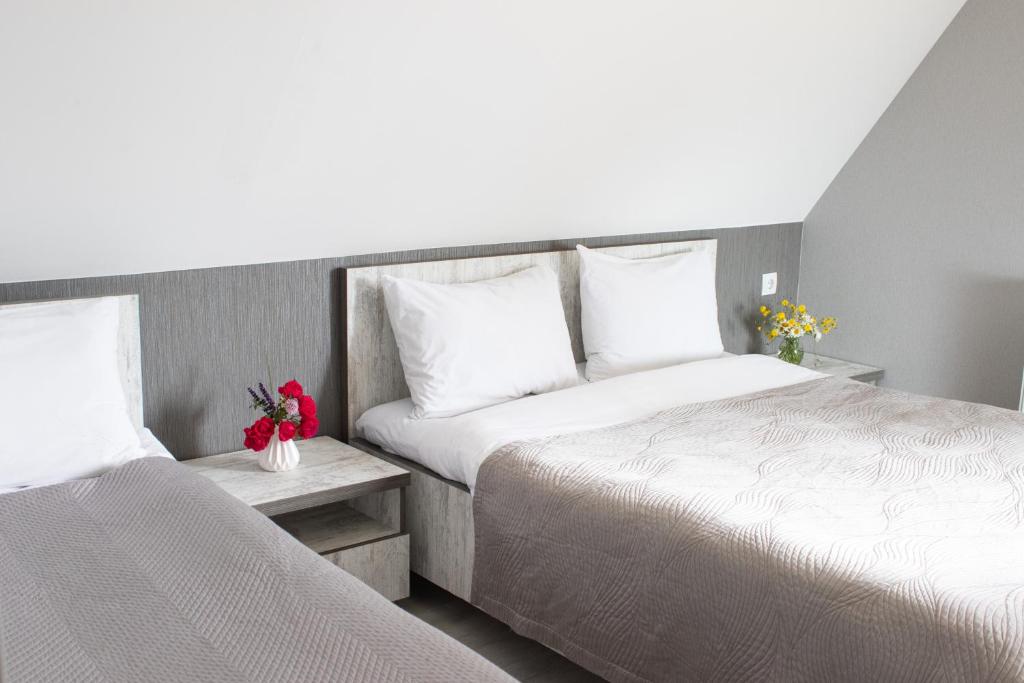 Postel nebo postele na pokoji v ubytování OISHE Boutique Hotel