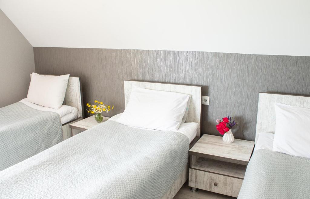 Postel nebo postele na pokoji v ubytování OISHE Boutique Hotel
