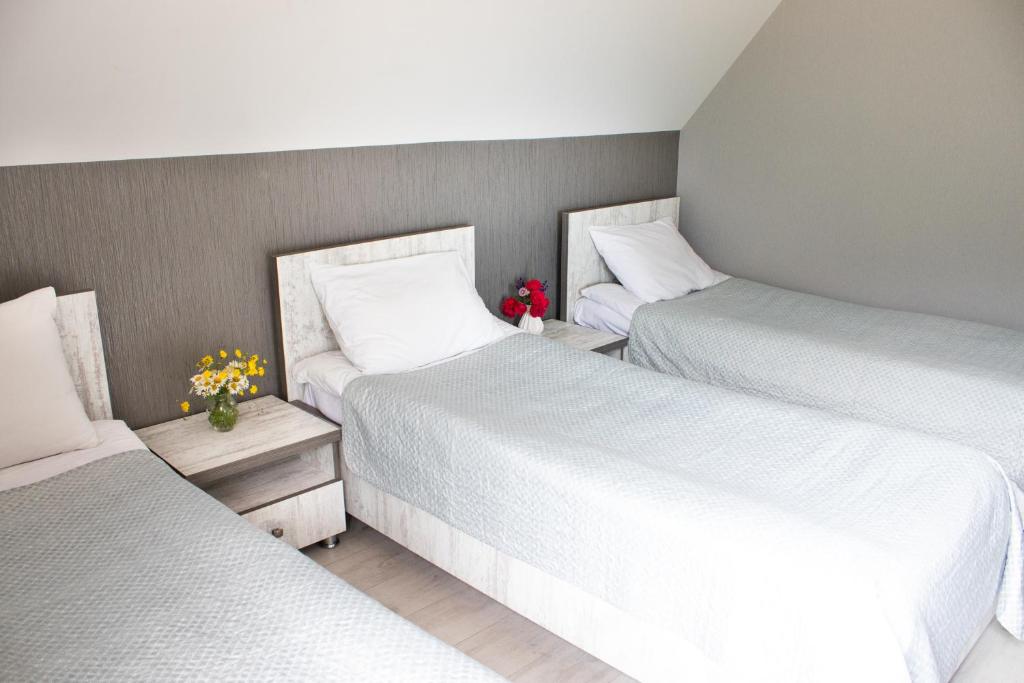 Postel nebo postele na pokoji v ubytování OISHE Boutique Hotel