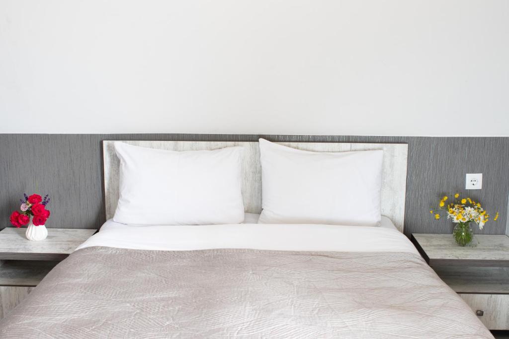 Postel nebo postele na pokoji v ubytování OISHE Boutique Hotel