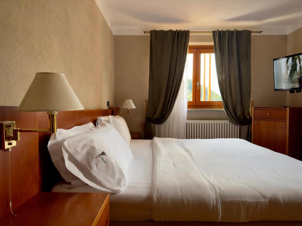 Postel nebo postele na pokoji v ubytování Hotel Le Bouquet - Adults Only