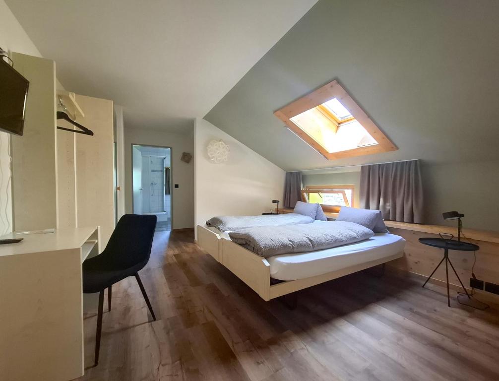 Postel nebo postele na pokoji v ubytování Hotel Alpina