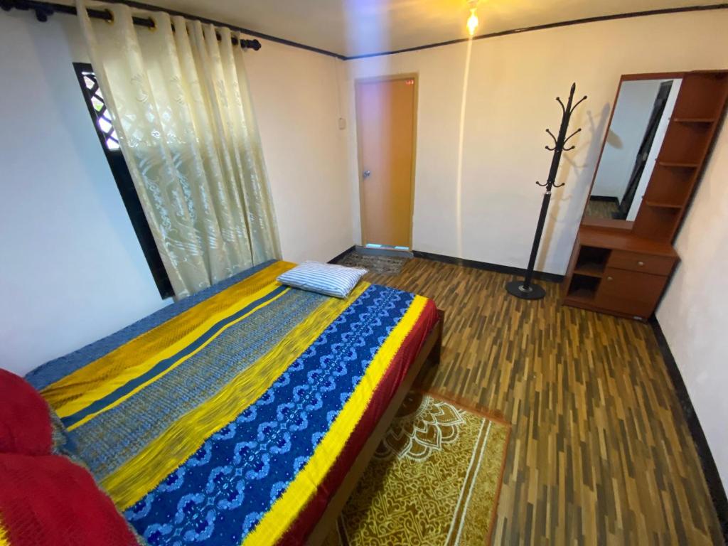 Postel nebo postele na pokoji v ubytování Queen's Mahal Rooms