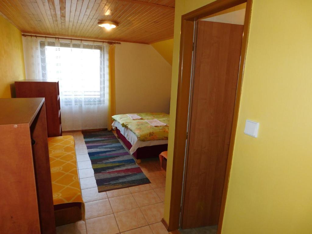 Postel nebo postele na pokoji v ubytování Apartmany Tania