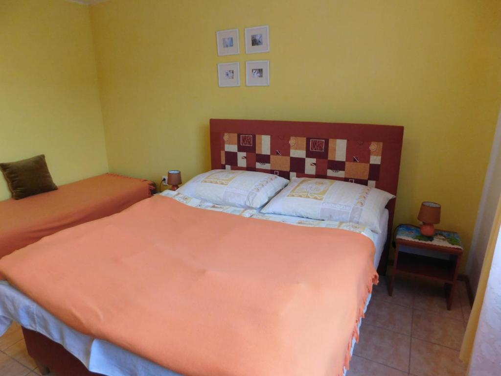 Postel nebo postele na pokoji v ubytování Apartmany Tania