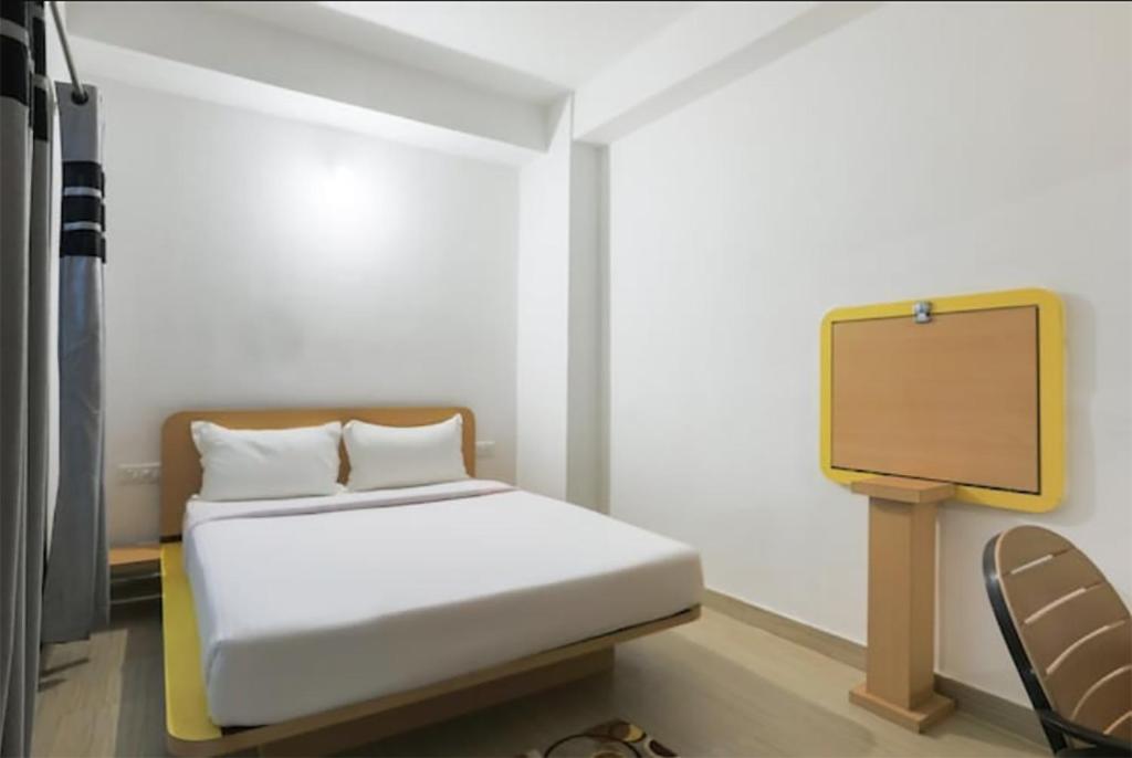 Postel nebo postele na pokoji v ubytování Hotel Gyan Regency