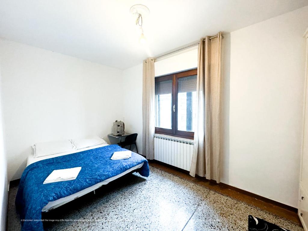 Postel nebo postele na pokoji v ubytování Venice B&B
