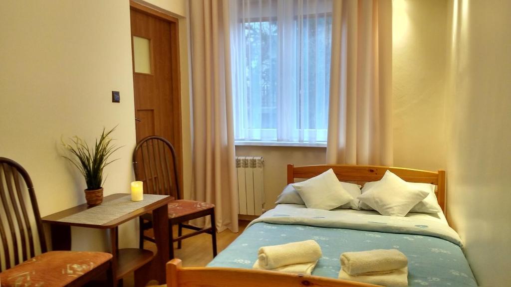 Postel nebo postele na pokoji v ubytování Pod Jarzębiną