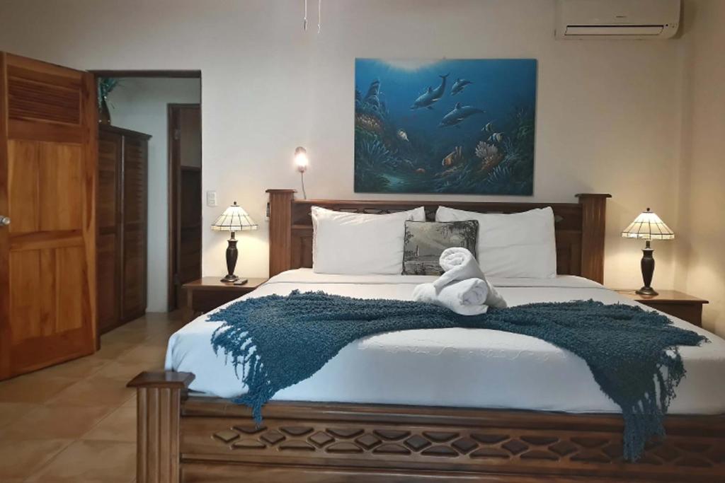 Postel nebo postele na pokoji v ubytování Mango Moon Villa
