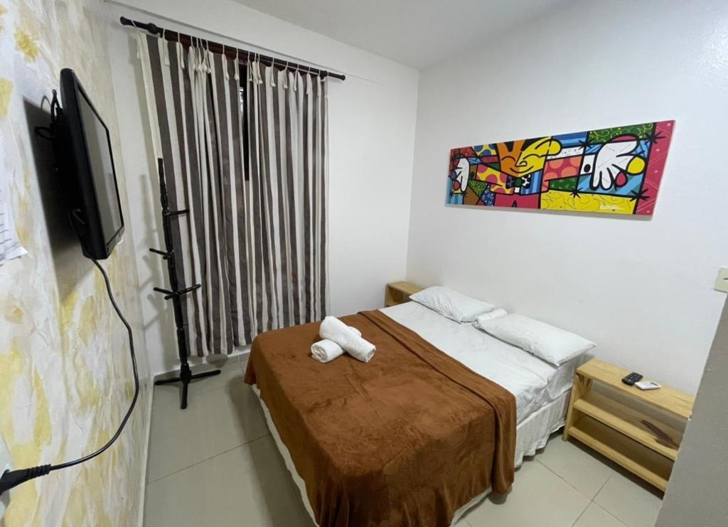 Un pat sau paturi într-o cameră la Sol da pipa CENTRO