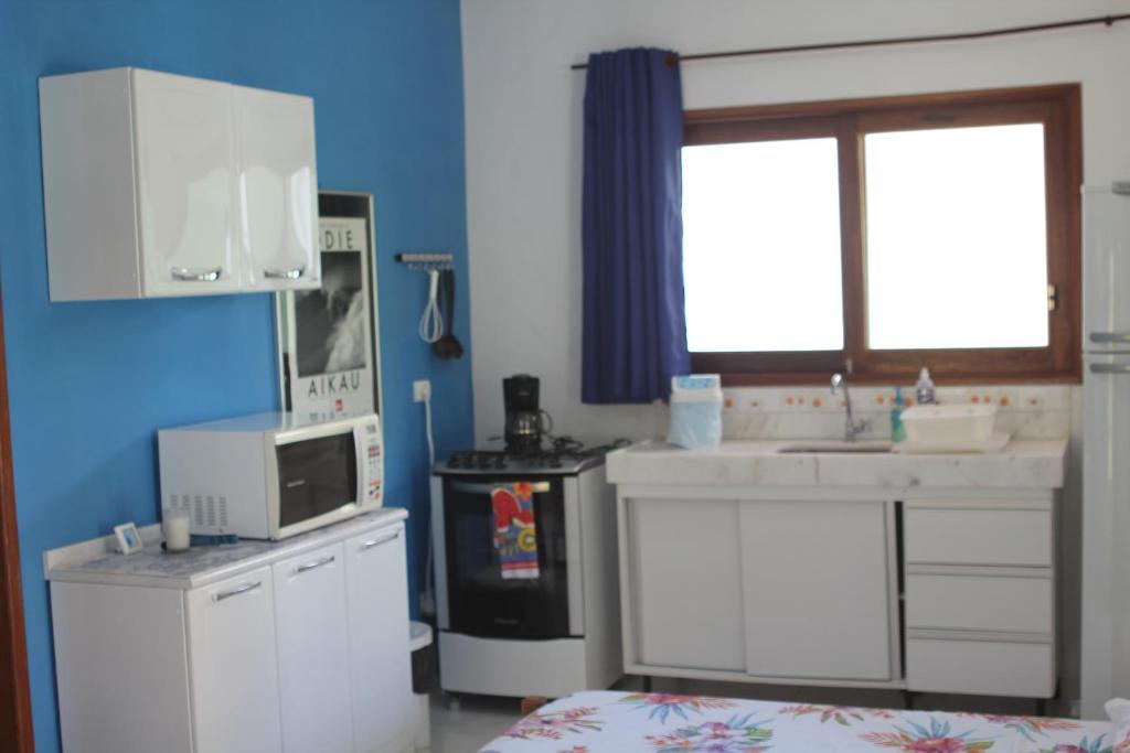 Kuchyň nebo kuchyňský kout v ubytování Pipa Hawaii Suites