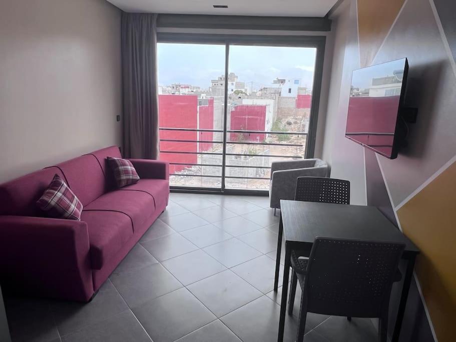 Posezení v ubytování Appartement No 6 vue sur mer au loin