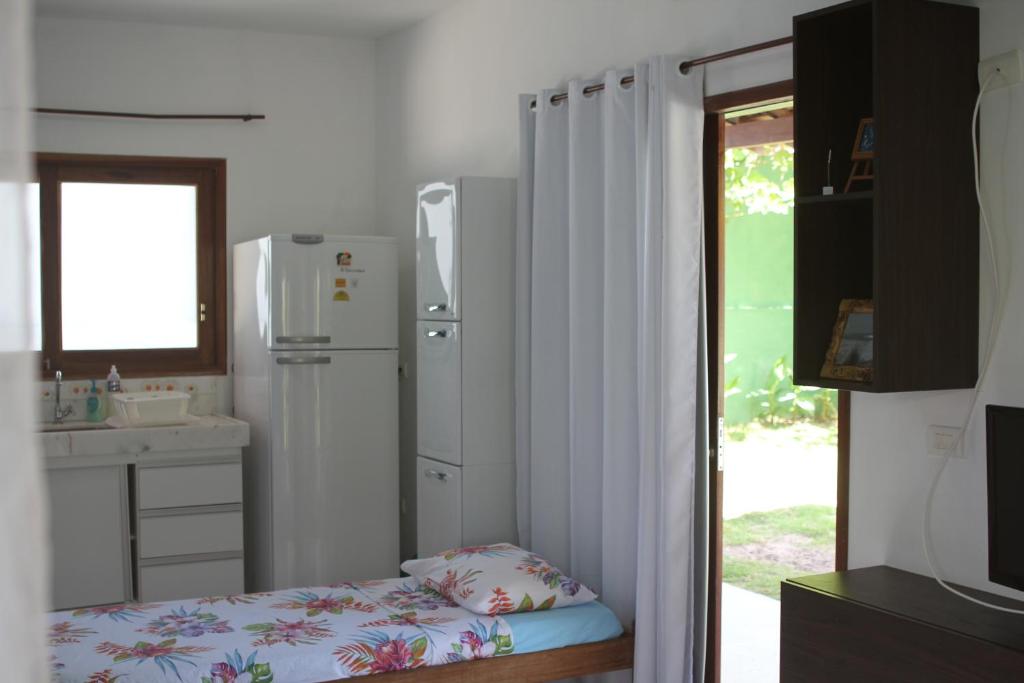 Kuchyň nebo kuchyňský kout v ubytování Pipa Hawaii Suites