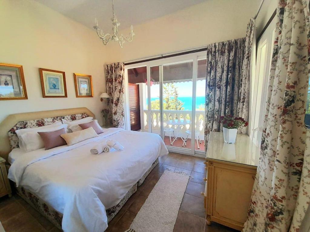 a bedroom with a bed with a view of the ocean at Plaza la marsa in Tunis