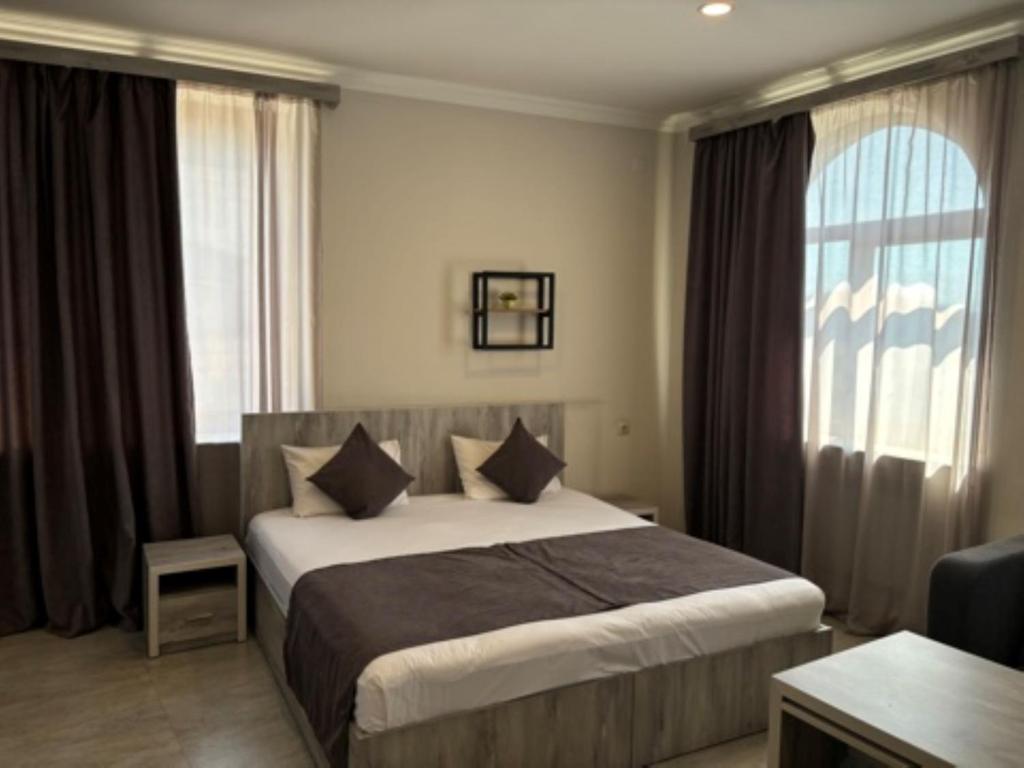 Postel nebo postele na pokoji v ubytování Hotel Menua
