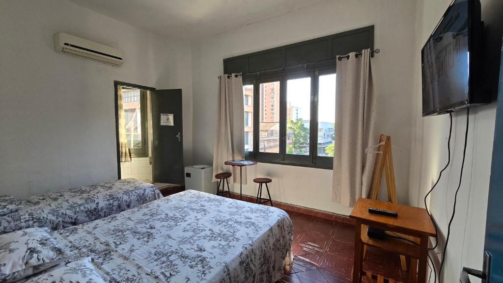 Un pat sau paturi într-o cameră la Tagua Hospedaje