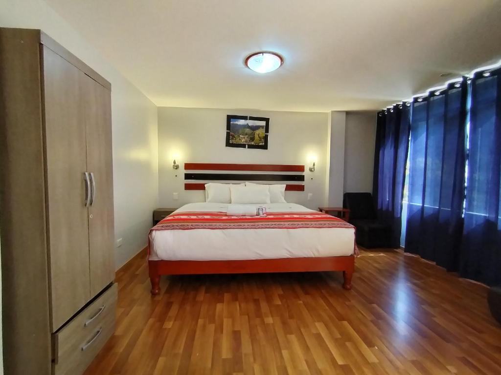 Postel nebo postele na pokoji v ubytování Raymi Inn MachuPicchu