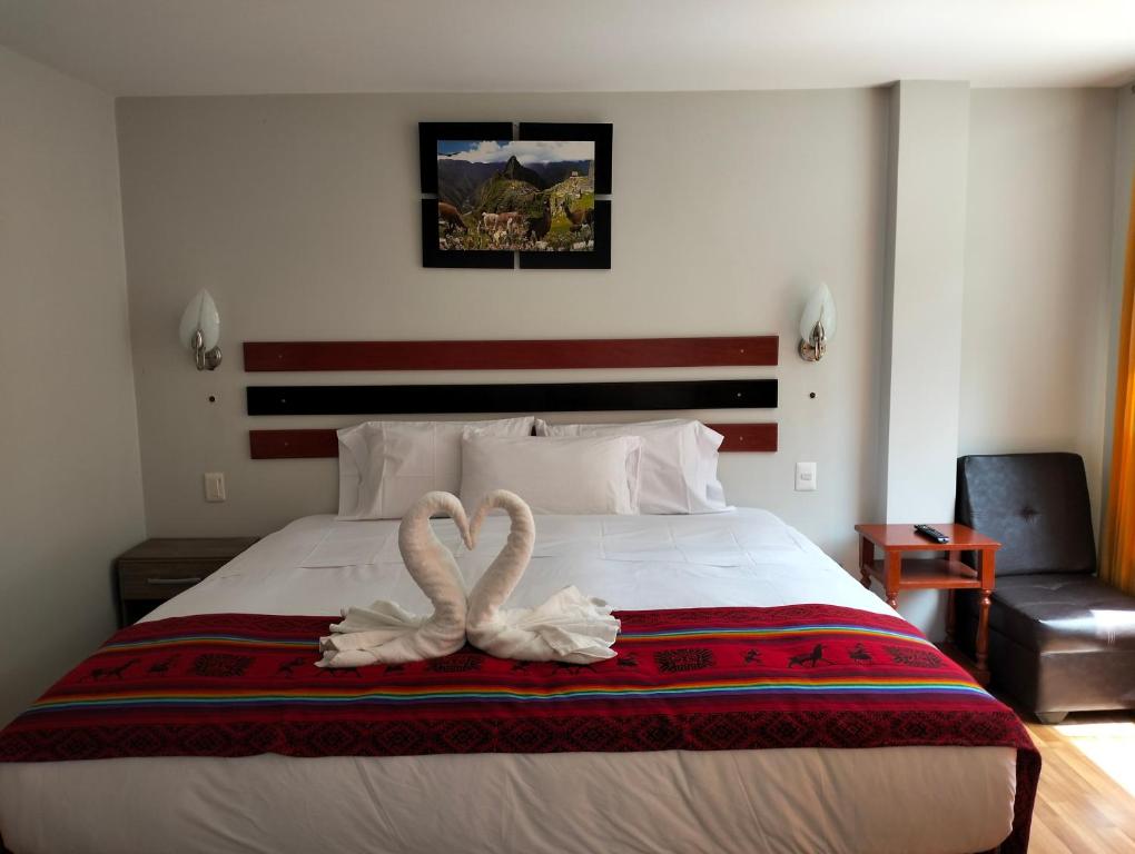 Postel nebo postele na pokoji v ubytování Raymi Inn MachuPicchu