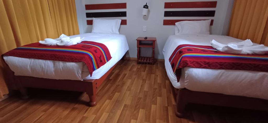 Postel nebo postele na pokoji v ubytování Raymi Inn MachuPicchu
