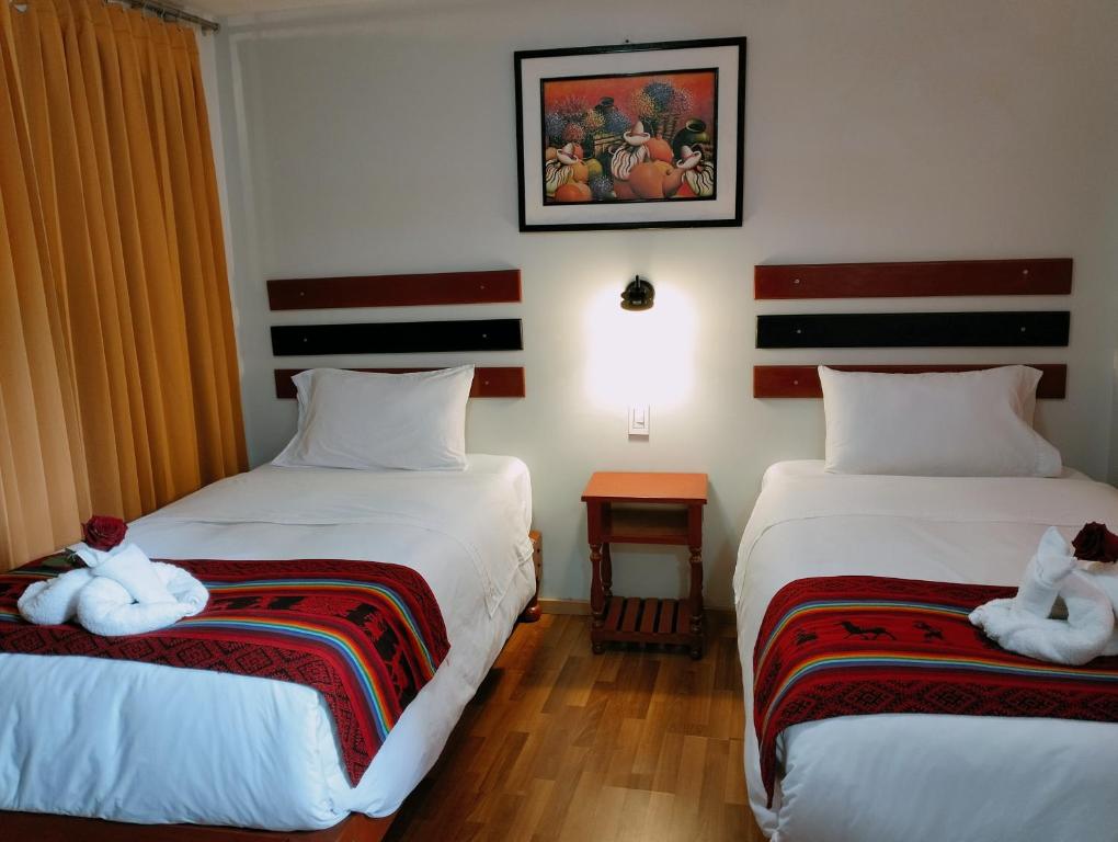 Postel nebo postele na pokoji v ubytování Raymi Inn MachuPicchu