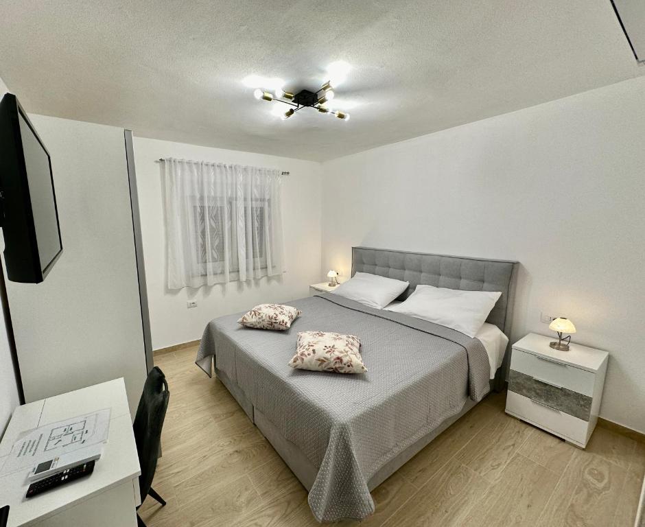Postel nebo postele na pokoji v ubytování Apartments Marijan & Marija