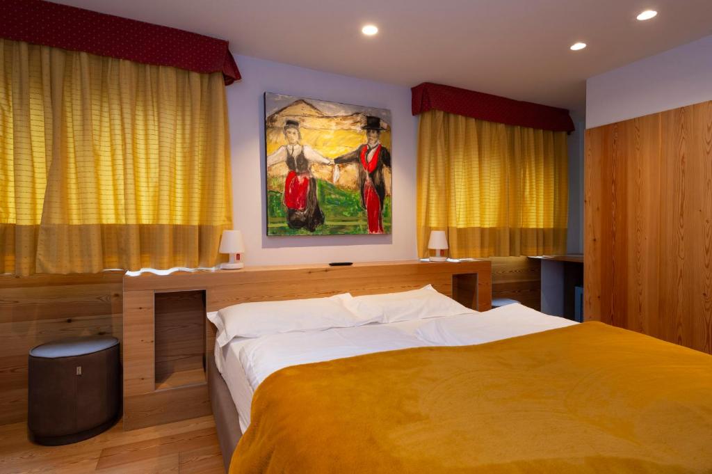 Postel nebo postele na pokoji v ubytování Hotel Zerbion