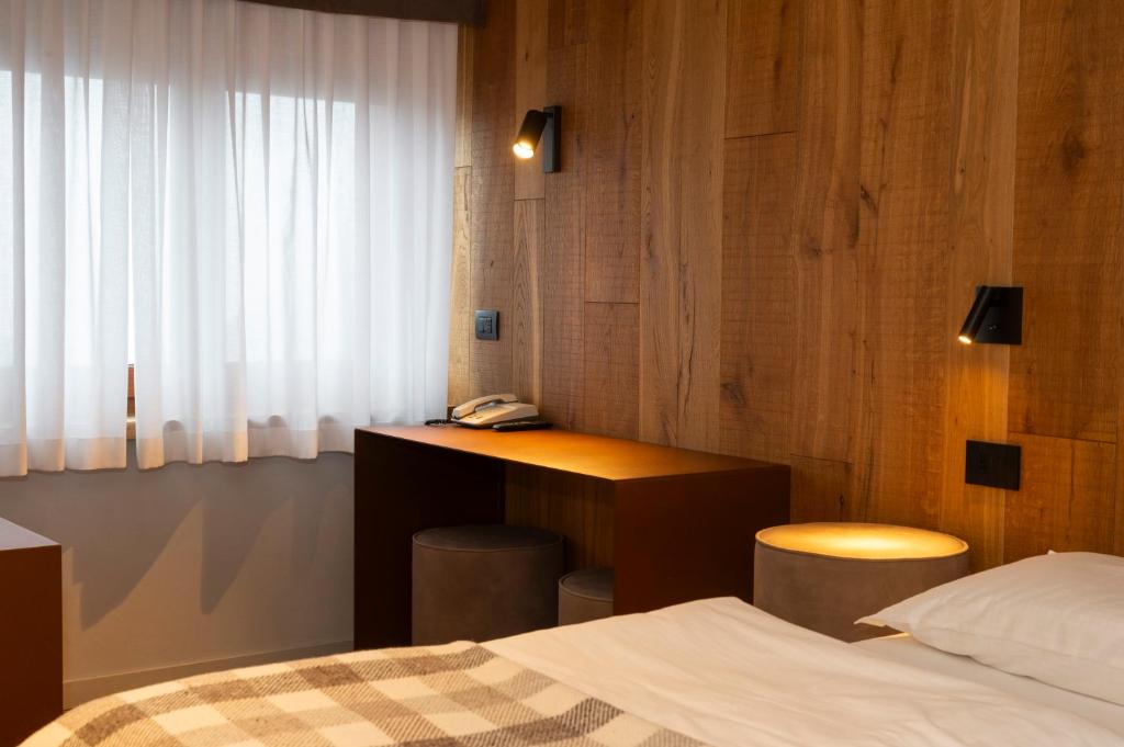 Postel nebo postele na pokoji v ubytování Hotel Zerbion