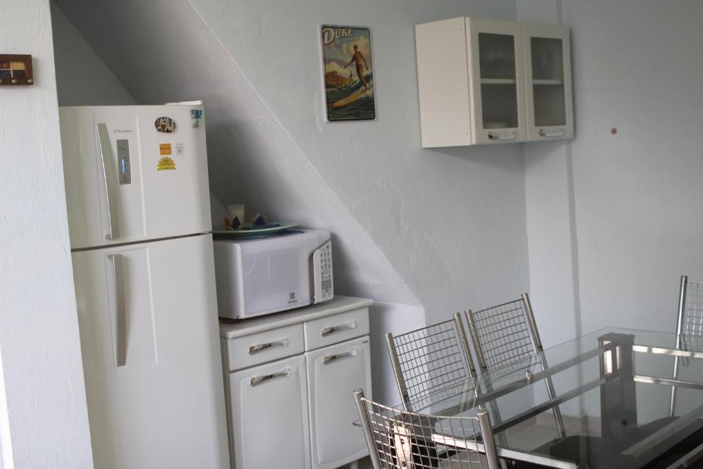Kuchyň nebo kuchyňský kout v ubytování Pipa Hawaii Suites