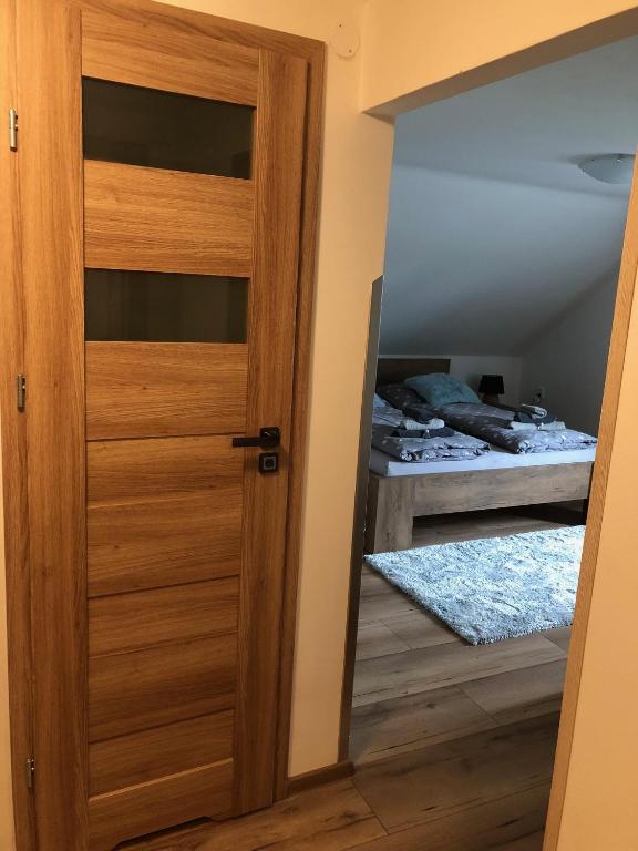 Postel nebo postele na pokoji v ubytování Na Rozcestí Frýdlant