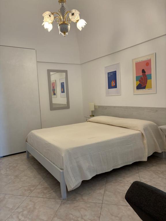 Una cama o camas en una habitación de Il Rifugio nel Vicolo