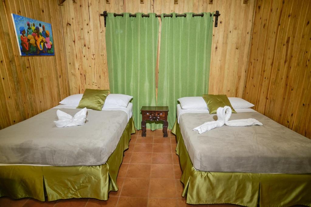 Postel nebo postele na pokoji v ubytování Hotel Playa Caribe